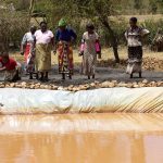 Women members of an agriculture group in Machakos, Kenya run a fish pond enterprise.